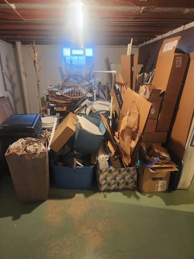 Roll-off dumpster container at job site for 2 Yard Dumpster Rental in Conroe